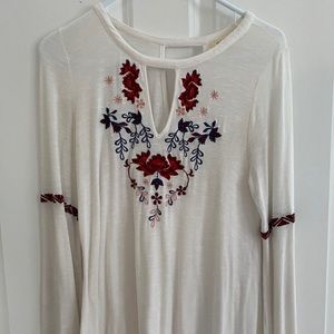 White long bell bottom sleeves. Flowers embedded